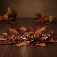 Load image into Gallery viewer, An autumn-themed decorative arrangement on a wooden surface, featuring dried orange slices, cinnamon sticks, star anise, and small red berries layered over brown, burgundy, and tan fall leaves. The background is softly blurred with warm autumnal tones.