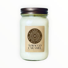 Load image into Gallery viewer, JD Candle Co. Tobacco Caramel scented soy wax candle in a 16 oz glass mason jar with a dark bronze lid.